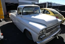 Front three-quarter view of the white Apache outdoors.