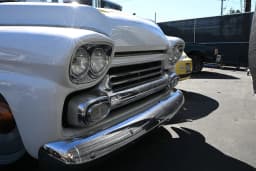 Front grille, headlights, and bumper.