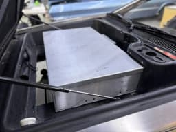 Front battery enclosure installation.