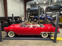 Full side profile with the convertible top down.