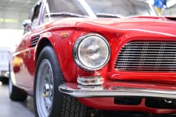 Front bodywork, headlamp, and wheel details.