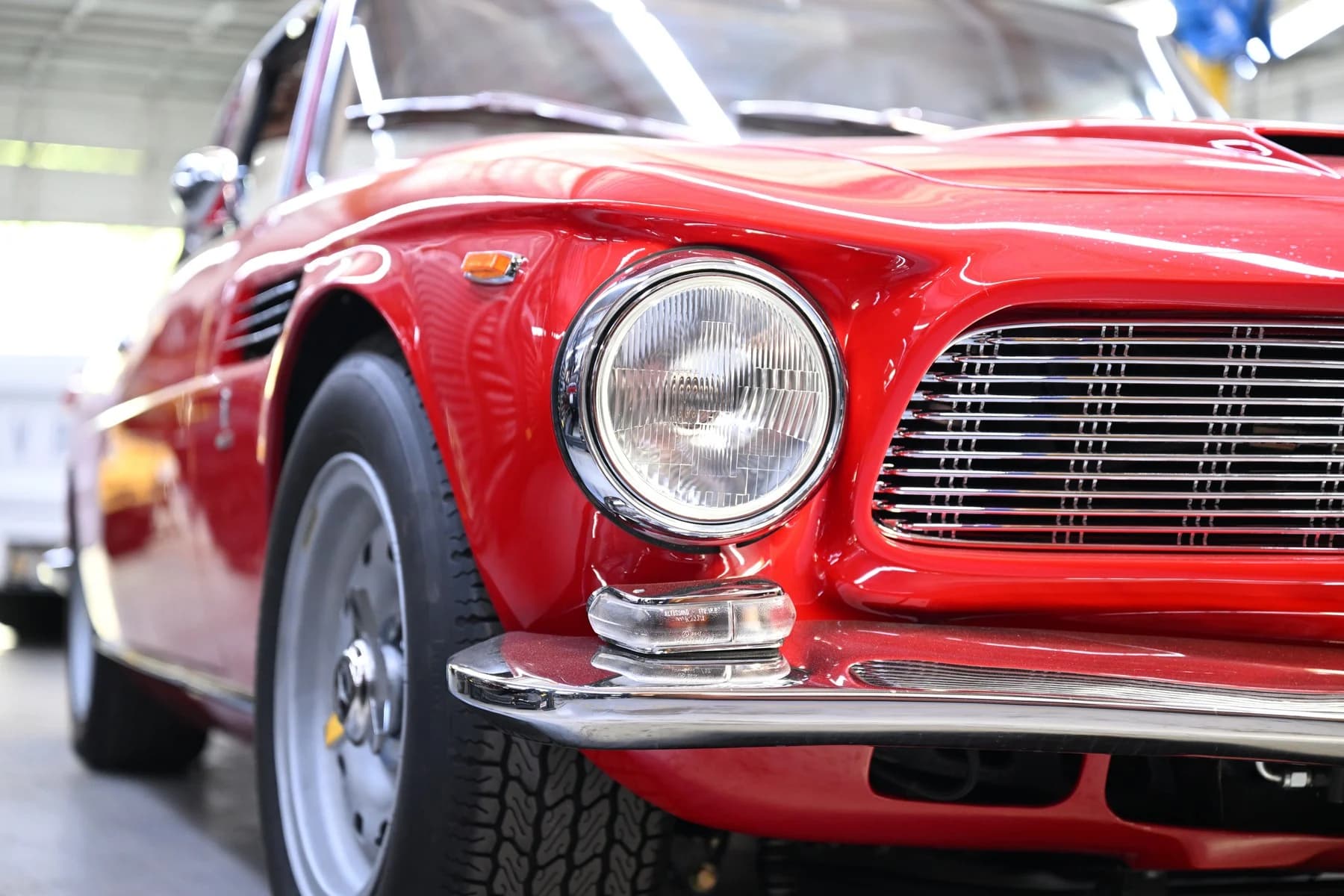 Front bodywork, headlamp, and wheel details.