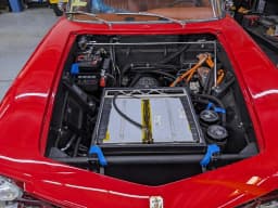 Electric drivetrain integration beneath the hood.