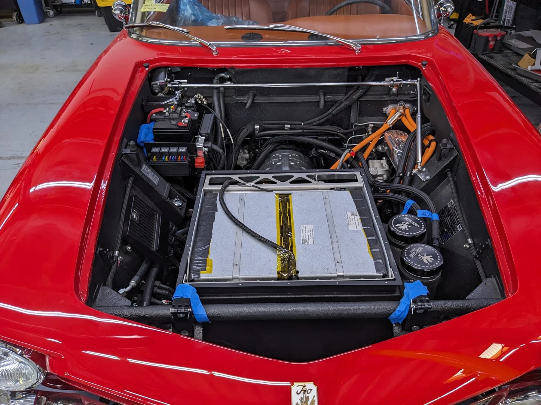 Electric drivetrain integration beneath the hood.