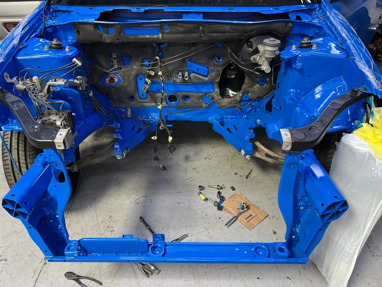 Engine-compartment preparation, October 2026.