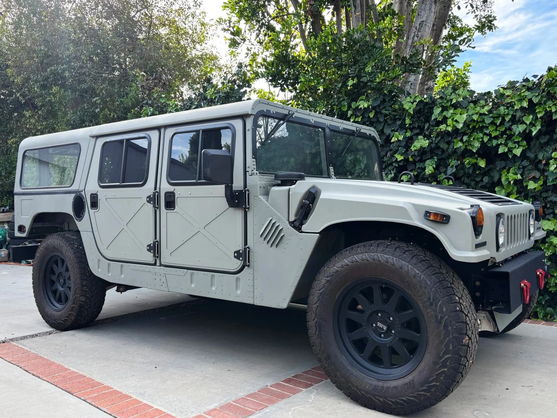 The grey Humvee outdoors.